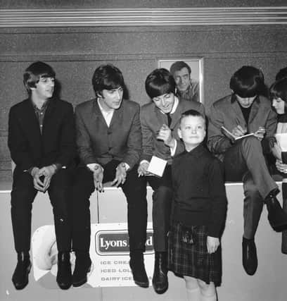 A young fan in a kilt gets to meet Ringo Starr, John Lennon, Paul McCartney and George Harrison when the Beatles came to the ABC cinema in Edinburgh in 1964