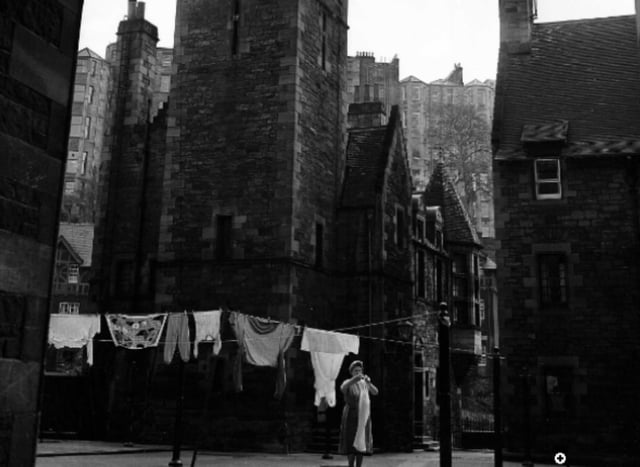 A woman hangs up her washing in Dean Village in April 1960.