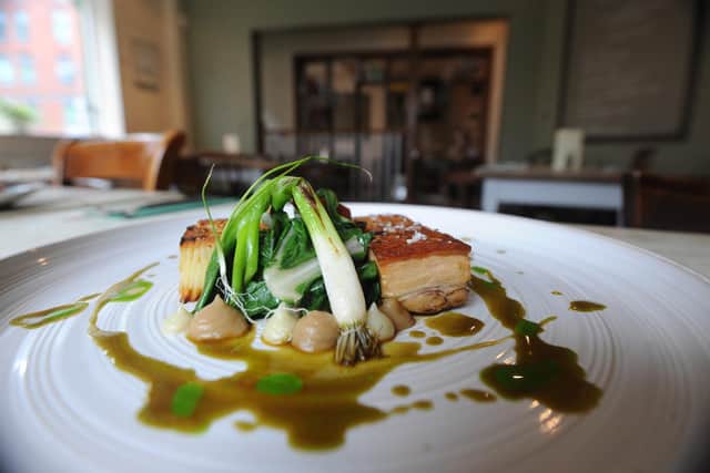 A classic Milestone dish. Belly of pork, fondant potato, chorizo, caramelized shallots, spring greens. Picture Scott Merrylees