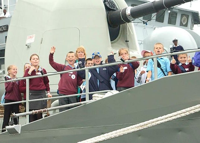 The International Festival of the Sea takes place at Portsmouth Royal Naval Dockyard between 30 June 2005 and 03 Jul 2005. Directorate of Naval Recruiting sponsored tickets for local schools and colleges. Pictured is a group of local children onboard a foreign warship.