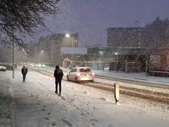 Children trudged through the snow on their way to school in Broomhill, Glasgow.