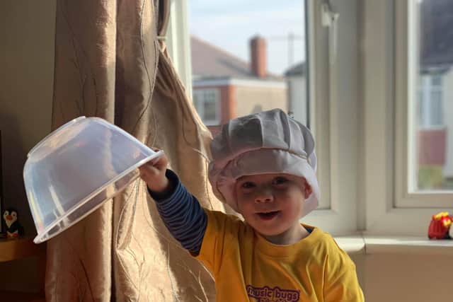Claire's son, Oliver dons a chef outfit for a zoom party.