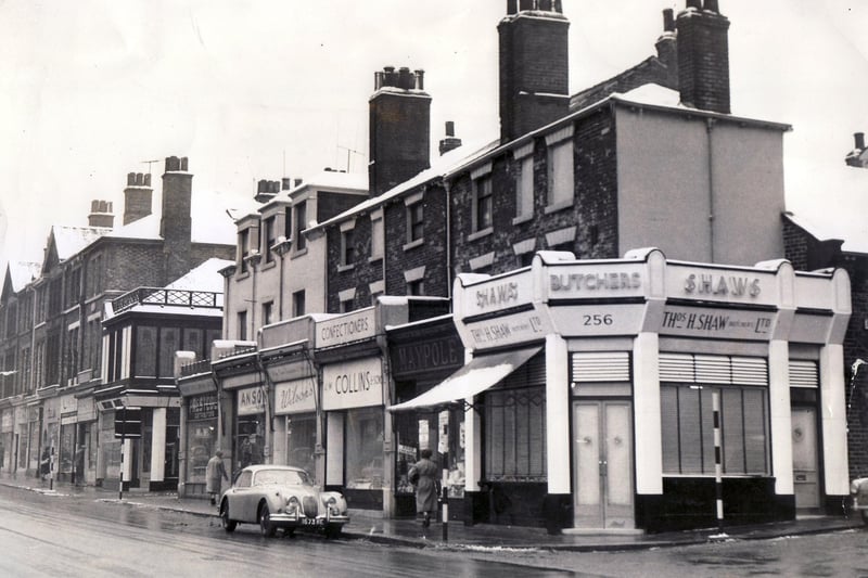 A row of shops including Collins Confectioners on West Street, Sheffield in January 1960