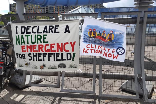 Banners outside a Sheffield Council full council meeting which read: "I declare a climate emergency for Sheffield" and "climate action now".