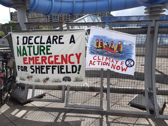 Banners outside a Sheffield Council full council meeting which read: "I declare a climate emergency for Sheffield" and "climate action now".