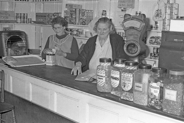 Jenny Nurse, right, and shop assistant Betty Hughes at the counter of Nurse's shop in Church Street, Hetton, which closed after more than 80 years trading in 1977.