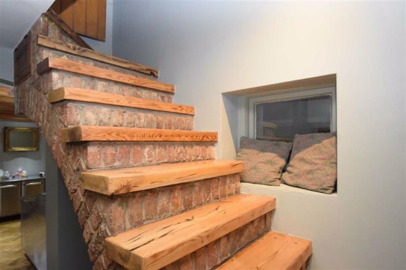 A wood and brick staircase inside the property.