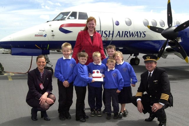 Pupils from Catcliffe School with Captain Doug Hale and Jane Dawson from British Airways celebrating the airline’s first anniversary of flying from Sheffield Airport.