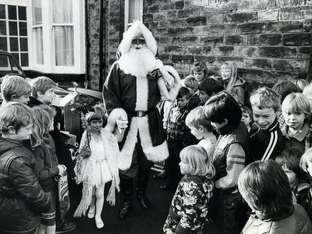 Father Christmas arrives by Rolls Royce to open the mini market in aid of Holy Trinity Millhouses Church Hall roof, which needs renewing.
11th December 1982