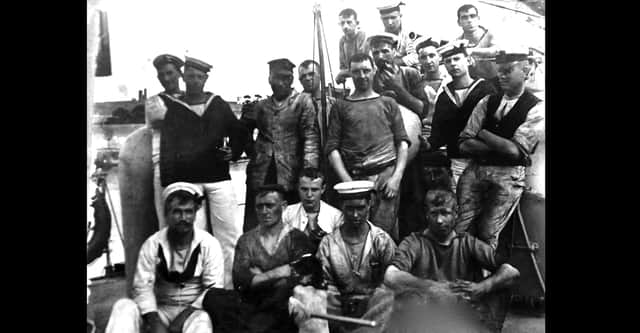 After coaling ship. Ships were all powered by furnaces.
Here we see some of the crew from the turtle-back destroyer HMS Chamois. 
Bottom centre of the photograph is the ships pet and to the left of it is George Harwood. He was the grandfather of George Millener who loaned us the photographs. Picture: George Millener collection
