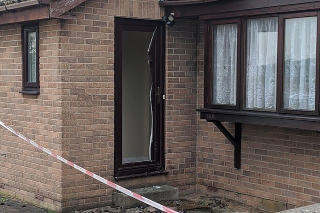 A neighbour who lives two doors down said firefighters kicked the front door in to gain entry to the house.
