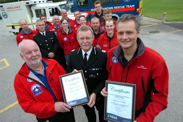 ACC Andy Holt(centre) presents the Chief Constable's Commendation awards to the Woodhead and the Edale Mountain Rescue Teams in 2008. Receiving the awards are left, Mike France (Woodhead) and  Ian Bunting (Edale)