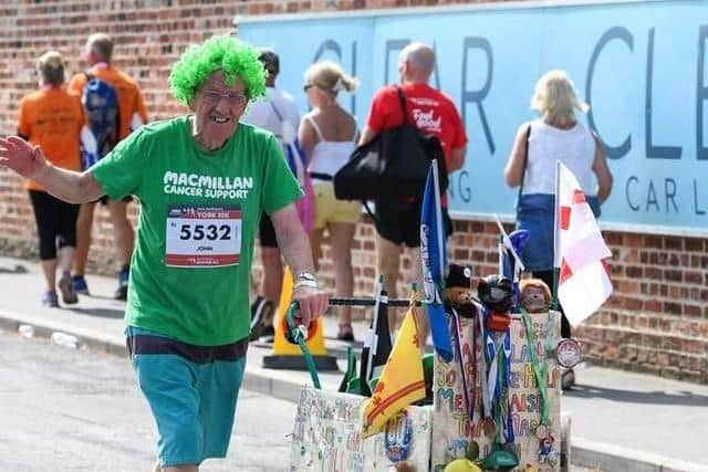 John Burkhill, at the age of 83, still pounds the streets of Sheffield pushing a pram to raise money for Macmillan Cancer Support
