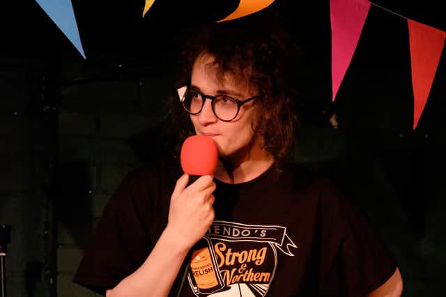Tommi Bryson compering a Sounds Queer event