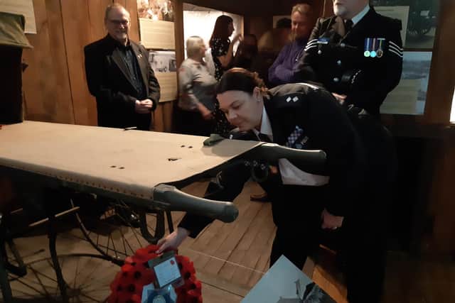Sheffield police Insp Danielle Spencer lays a poppy wreath at the For King and Country exhibition in the National Emergency Services Museum in Sheffield