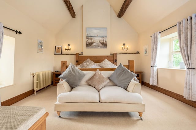 The main bedroom has been meticulously designed and the high ceilings alongside the exposed wooden beams give the room lots of character.