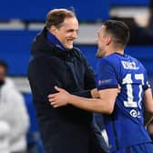 Chelsea's German head coach Thomas Tuchel (L) and Chelsea's Croatian midfielder Mateo Kovacic react at the final whistle during the UEFA Champions League round of 16 second leg football match between Chelsea and Atletico Madrid at Stamford Bridge in London on March 17, 2021: BEN STANSALL/AFP via Getty Images