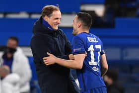 Chelsea's German head coach Thomas Tuchel (L) and Chelsea's Croatian midfielder Mateo Kovacic react at the final whistle during the UEFA Champions League round of 16 second leg football match between Chelsea and Atletico Madrid at Stamford Bridge in London on March 17, 2021: BEN STANSALL/AFP via Getty Images
