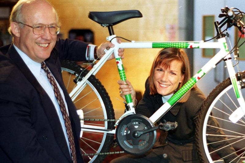 Britiv soft drinks manager Mike Imrie presents Julie Bryne with a new bike after she won it in a competition in the Doncaster Dome in 1997