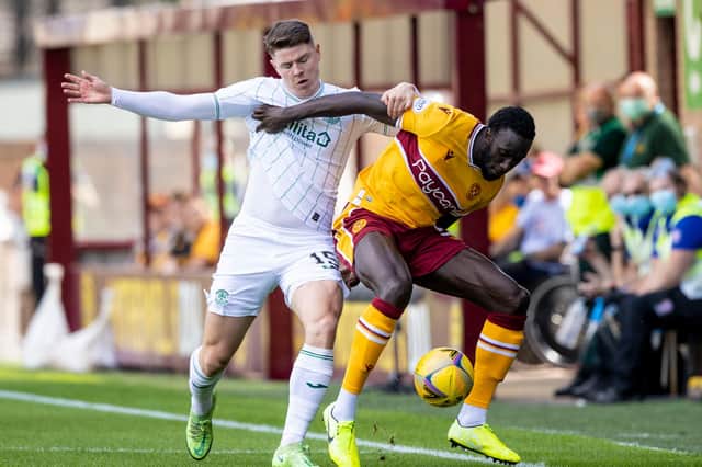 Motherwell's Bevis Mugabi competes with Kevin Nisbet