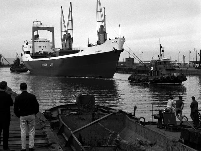 MV Salerno, cargo ship, is towed to the fitting-out basin after her launching from Henry Robb's shipyard, 1965.