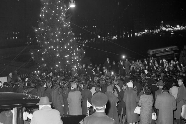 Crowds gather around the Mound Christmas tree for the big switch on in December 1963.