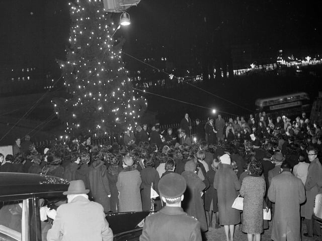Crowds gather around the Mound Christmas tree for the big switch on in December 1963.