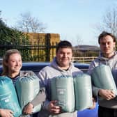 Ellie Dawson, Ben Marshall (centre) and Jason Moore with some of the sleeping bags and thermal blankets already donated ready to be taken to Poland