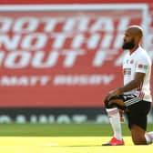 David McGoldrick of Sheffield United takes a knee in support of the Black Lives Matter movement prior to the Premier League match between Manchester United and Sheffield United at Old Trafford on June 24, 2020 in Manchester, England. (Photo by Michael Steele/Getty Images)