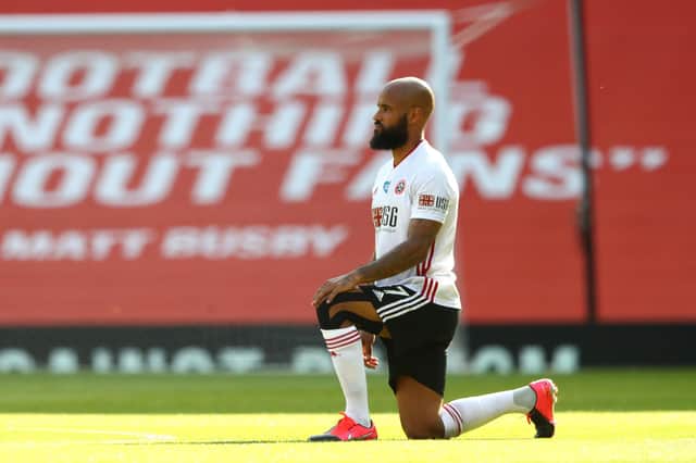David McGoldrick of Sheffield United takes a knee in support of the Black Lives Matter movement prior to the Premier League match between Manchester United and Sheffield United at Old Trafford on June 24, 2020 in Manchester, England. (Photo by Michael Steele/Getty Images)