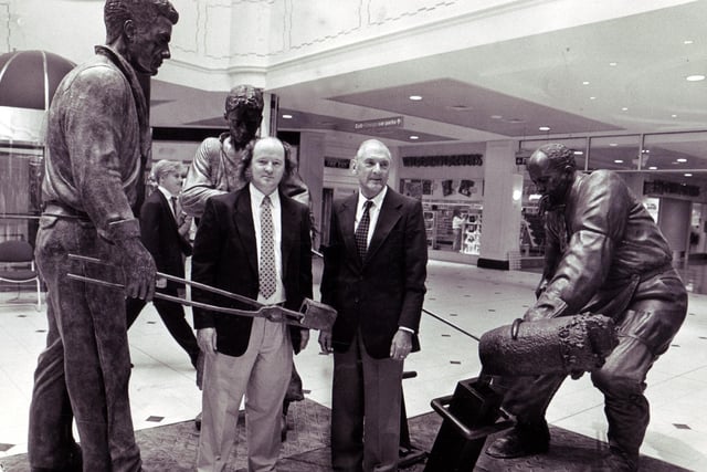 Sheffield teemer George Dalton, left, and sculptor, Robin Bell, with the bronze figures depicting the traditional teeming that were unveiled by Mr Dalton at Meadowhall Shopping Centre, September 1990