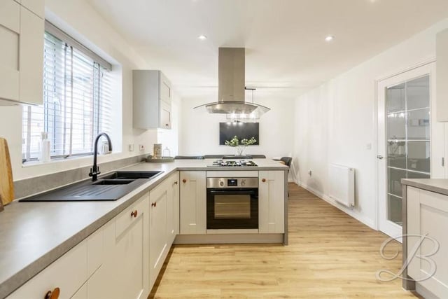 At the end of a lengthy entrance hallway, you will walk in to this modern kitchen/diner, which is an open-plan space sure to impress. It comes complete with a contemporary range of matching units and cabinets, with complementary work surface over, inset sink and drainer, and integrated oven with gas hob and stainless steel extractor fan.