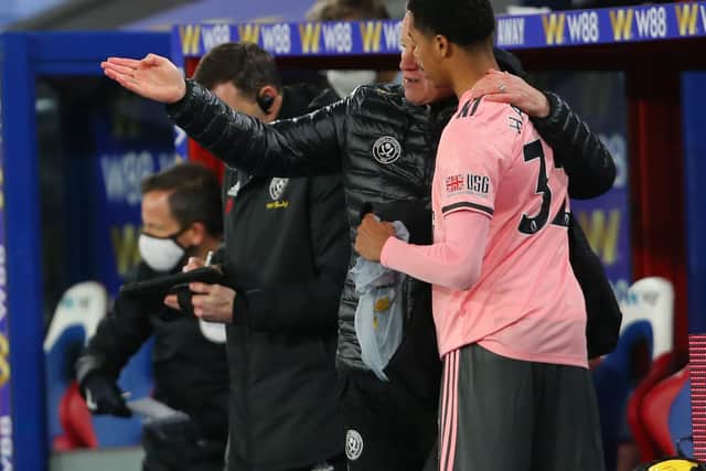 Antwoine Hackford of Sheffield United receives instructions from Chris Wilder before making his debut in the Premier League away at Crystal Palace: Paul Terry/Sportimage