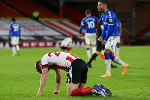 Sheffield United's Ben Osborn reacts at full time during the English Premier League football match between Sheffield United and Everton at Bramall Lane: ALEX LIVESEY/POOL/AFP via Getty Images