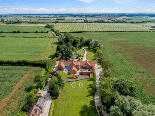 The huge grounds offer plenty of privacy, with gardens located to both the front and rear including a Helipad and extensive garaging which can accommodate several cars. One garage block also boasts a self-contained annex above.