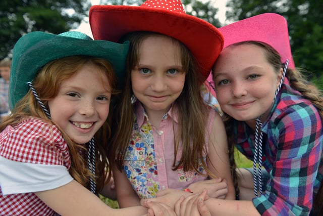 Charley Todd, Amy Fielding and Katie Connelly in their hats at the fun day.