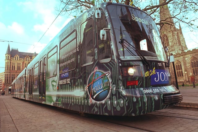 The Supertram 'fully-wrapped' in advertising, at the Cathedral tram stop in 1999
