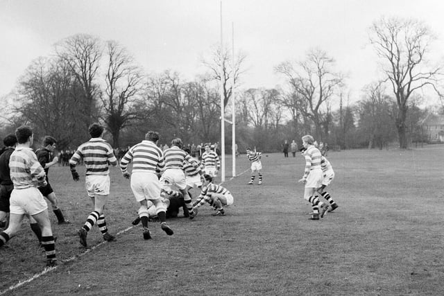 W Laidlaw scores his team's second try in a match between Merchiston Castle and Mill Hill at Colinton in December 1964.