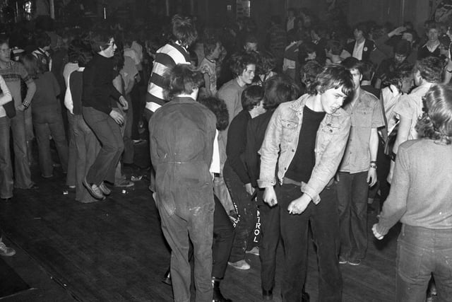 Early punks - fans of The Stranglers dancing at their concert Edinburgh in February 1978.