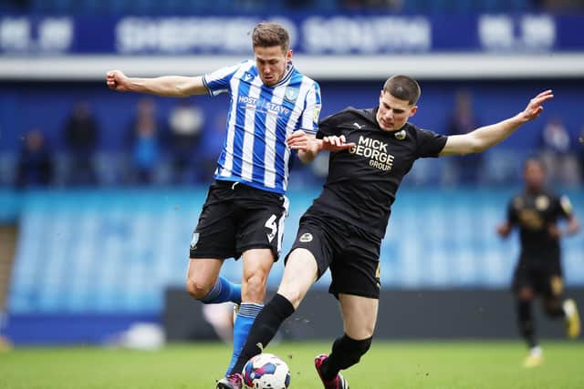 Sheffield Wednesday's Will Vaulks and Peterborough United's Ronnie Edwards battle for the ball. (Isaac Parkin/PA Wire)