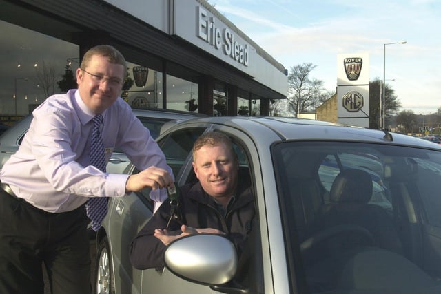 Darran Wheelhouse pictured receiving the keys to his prize  MGZR car froim Eric Stead sales manager Dennis Berry at their Ecclesfield Common showroom  in 2003