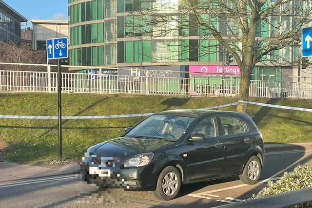 A member of the public said a car is inside the cordon and appears to have a damaged windscreen.