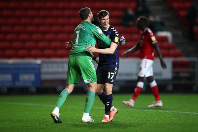 Marcus Bettinelli and Paddy McNair of Middlesbrough.