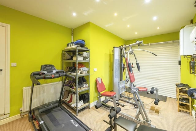 Garage/ Gym - The garage is currently being used as a gym and has electric door, light and power.