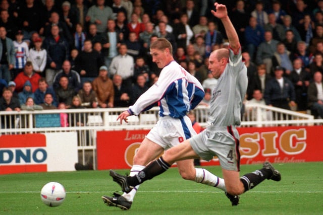 Eifion Williams slots home against Darlington in a 4-1 away win for Pools in 2002.