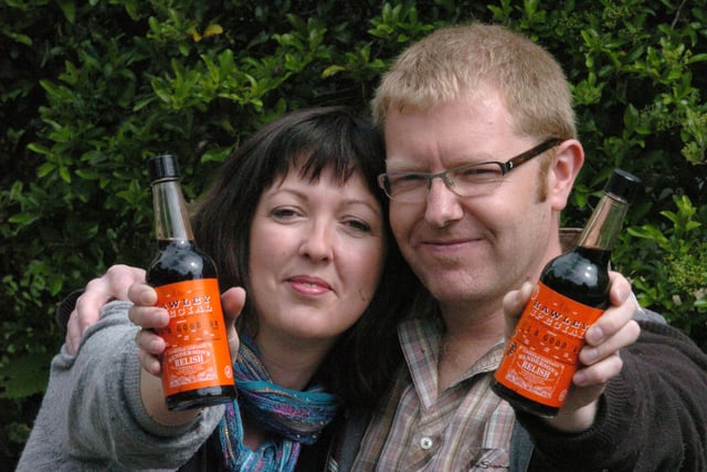 Samantha Lear and her partner Simon Piper with bottles of Richard Hawley-labelled Henderson's Relish, donated by the city guitar star to help the couple with charity fundraising in 2009