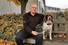 PC Lee Schofield and PD Winston celebrate their award win.
