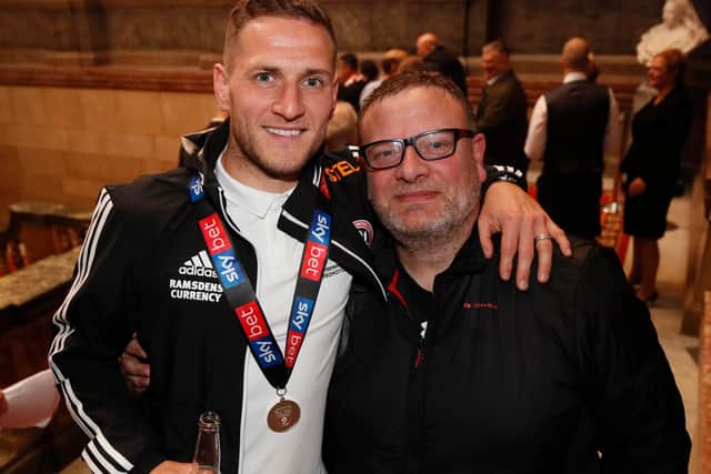 Photographer Simon Bellis with Sheffield United captain Billy Sharp during the club's celebrations after being promoted to the Premier League: Simon Bellis/Sportimage
