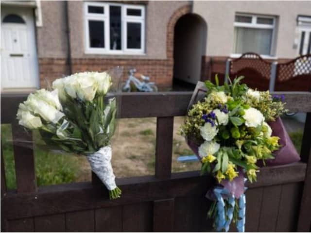 Floral tributes have been left at the house in Welfare Road, Woodlands. (Photo: SWNS).