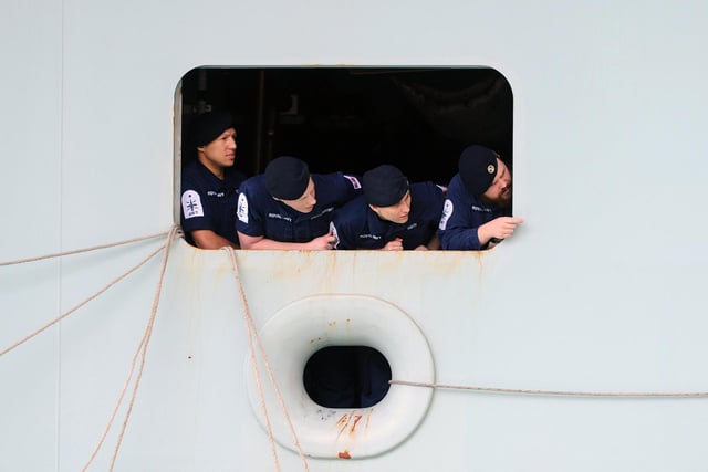 Sailors on HMS Queen Elizabeth as she returns to Portsmouth. Picture: (020720-5208)